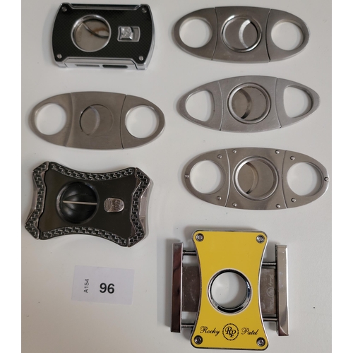 96 - SEVEN CIGAR CUTTERS
of various sizes and designs
Note: You must be over the age of 18 to bid on this... 