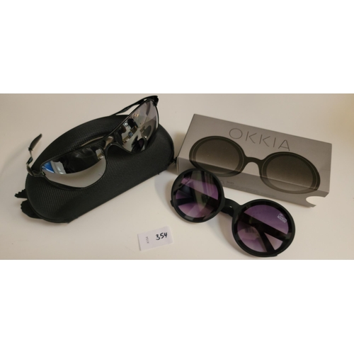 354 - TWO PAIRS OF DESIGNER SUNGLASSES
comprising a pair of Oakley sunglasses in case and a pair of new an... 