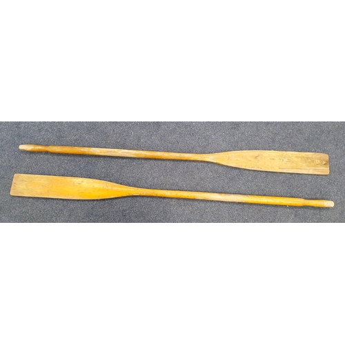 401 - PAIR OF VINTAGE PINE OARS
with turned handles, 182cm long (2)