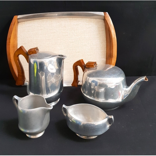 413 - FIVE PIECE PIQUOT WARE SET
comprising teapot, hot water pot, cream jug and sugar bowl; on teak handl... 