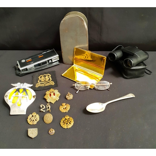 ASSORTMENT OF COLLECTIBLES
including RAF cap badges, Royal Scots badge, AA car badge, plateded spoon with RAF insignia, cigarette case, pocket autopak 460tx, metal case, binoculars, etc.