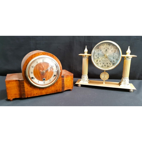 420 - ART DECO MAHOGANY CHIMING MANTLE CLOCK
raised on ball feet; together with an ornate contemporary man... 