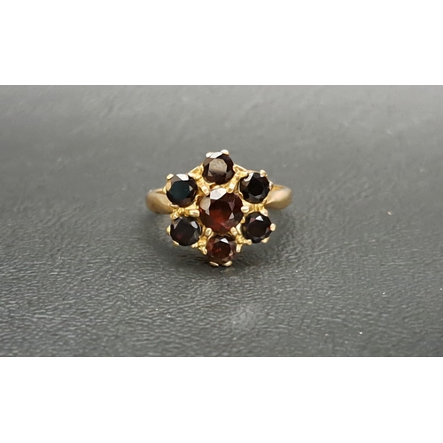 170 - CARNET CLUSTER RING
the central round cut garnet approximately 0.6cts in six garnet surround, on nin... 