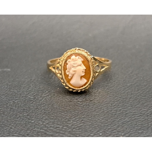 173 - CAMEO DRESS RING
the oval cameo in rope twist surround and flanked by pierced shoulders, on nine car... 