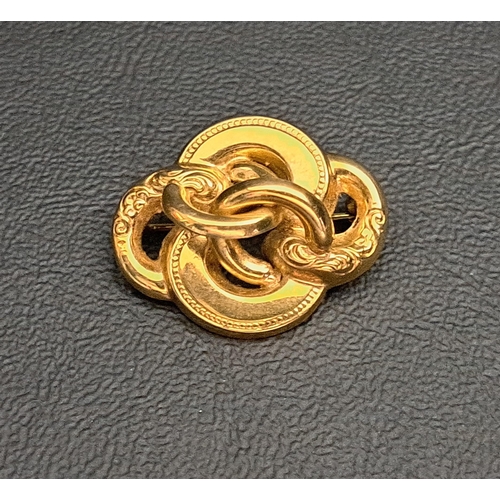 197 - NINE CARAT GOLD BROOCH
of entwined knot design, 2.6cm wide and 2.8 grams