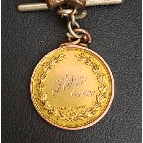 199 - NINE CARAT GOLD MEDAL FOB
one side with a boat decorated shield below a banner reading 'LIFE MEMBER'... 