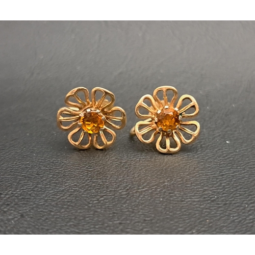 203 - PAIR OF CITRINE SET NINE CART GOLD FLOWER DESIGN EARRINGS
with screw clasps, total weight approximat... 