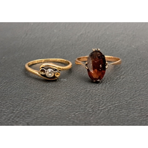 218 - TWO GEM SET GOLD RINGS
one with diamond in twist setting (two side diamonds lacking); and the other ... 