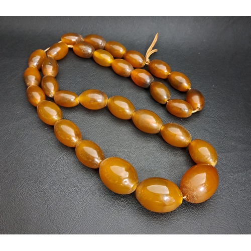 108 - GRADUATED DARK BUTTERSCOTCH AMBER BEAD NECKLACE
the largest bead approximately 3cm long, total weigh... 