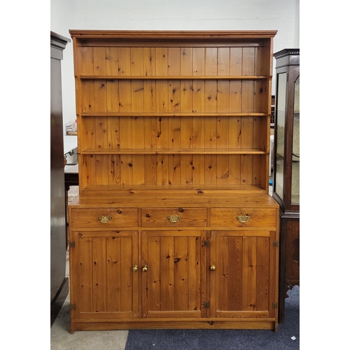 700 - VINTAGE PINE WELSH DRESSER
the three open shelves above three drawers and with three cupboard doors ... 