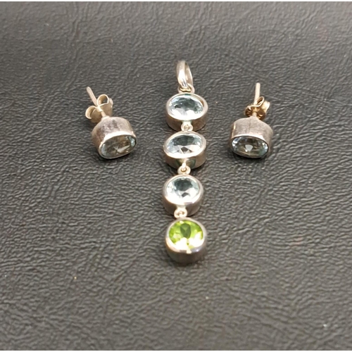 16 - AQUAMARINE AND PERIDOT DROP PENDANT
the three graduated round cut aquamarines above a round cut peri... 