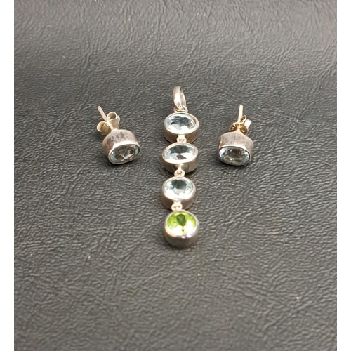 16 - AQUAMARINE AND PERIDOT DROP PENDANT
the three graduated round cut aquamarines above a round cut peri... 