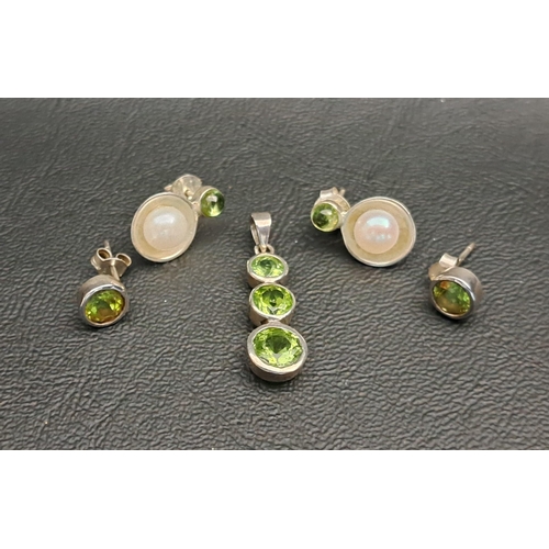 48 - GRADUATED PERIDOT SET PENDANT
the largest of the three peridots measuring approximately 1ct; togethe... 