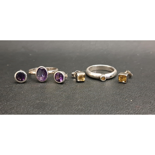 60 - TWO GEM SET RINGS AND MATCHING STUD EARRINGS
comprising an oval cut amethyst set ring measuring appr... 