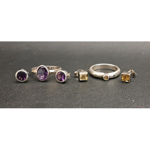 60 - TWO GEM SET RINGS AND MATCHING STUD EARRINGS
comprising an oval cut amethyst set ring measuring appr... 