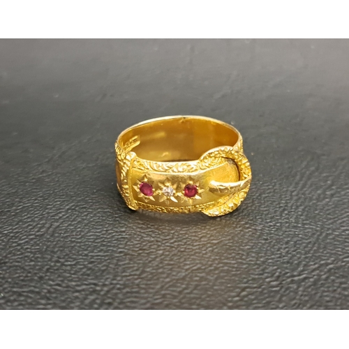 183 - EDWARDIAN DIAMOND AND RUBY SET EIGHTEEN CARAT GOLD BUCKLE RING
the ring set with two rubies flanking... 