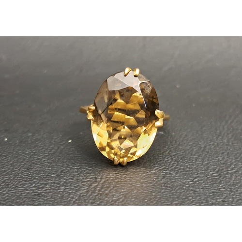 196 - SMOKY QUARTZ SINGLE STONE DRESS RING
the quartz measuring approximately 17mm x 12.8mm x 7.4mm, on ni... 