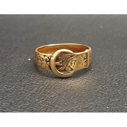 198 - GEORGE V NINE CARAT GOLD BUCKLE DESIGN RING
with engraved scroll decoration, ring size O and approxi... 