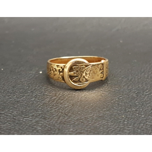 198 - GEORGE V NINE CARAT GOLD BUCKLE DESIGN RING
with engraved scroll decoration, ring size O and approxi... 