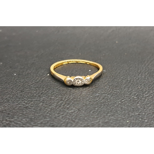 202 - ILLUSION SET DIAMOND THREE STONE RING
on eighteen carat gold shank with platinum setting, ring size ... 