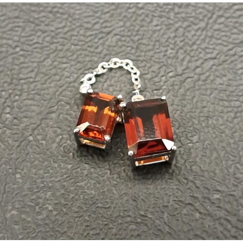 10 - GARNET AND DIAMOND PENDANT
the two rectangular cut garnets below small diamond chips with chain loop... 