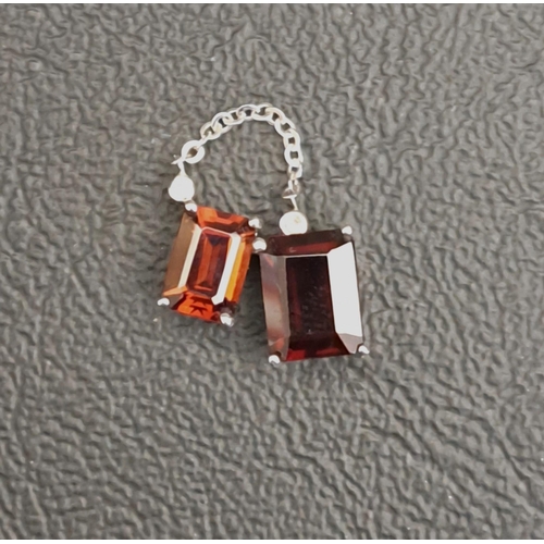 10 - GARNET AND DIAMOND PENDANT
the two rectangular cut garnets below small diamond chips with chain loop... 