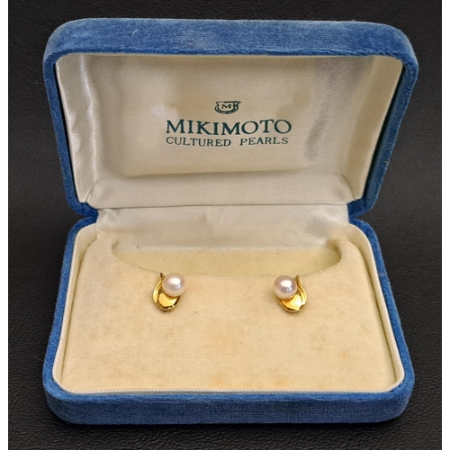 126 - PAIR OF MIKIMOTO PEARL STUD EARRINGS
the single pearl on each earring on stylised teardrop shaped mo... 