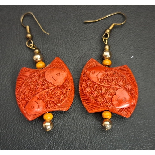 171 - CHINESE RED CINNABAR LACQUER BANGLE AND PAIR OF EARRINGS
the bangle with carved dragon decoration an... 