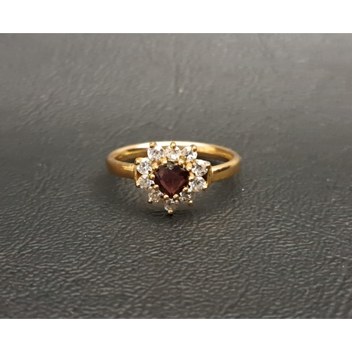 179 - GARNET AND CZ CLUSTER RING
the heart shaped garnet in CZ surround, on nine carat gold shank, ring si... 