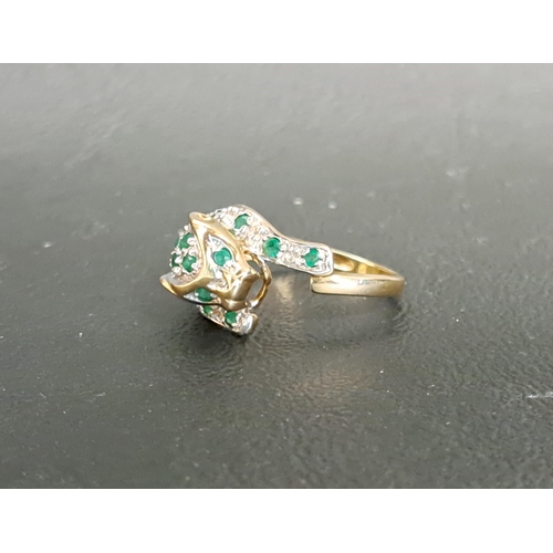 35 - DIAMOND AND EMERALD SET CARTIER STYLE PANTHER RING
the panther with pave set diamond and emeralds, i... 