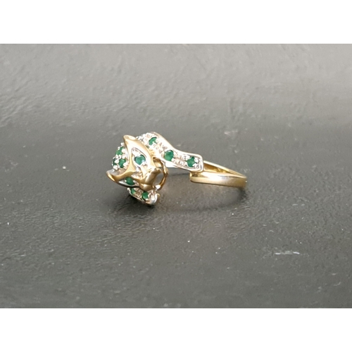 35 - DIAMOND AND EMERALD SET CARTIER STYLE PANTHER RING
the panther with pave set diamond and emeralds, i... 