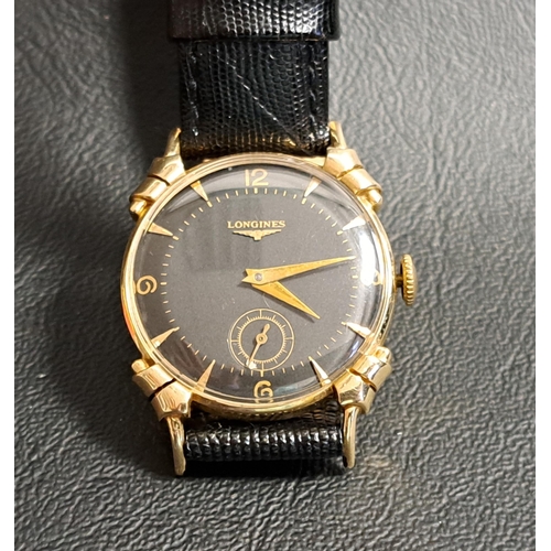 132 - GENTLEMAN'S LONGINES FOURTEEN CARAT GOLD CASED WRISTWATCH
circa 1950, the black dial with Arabic num... 