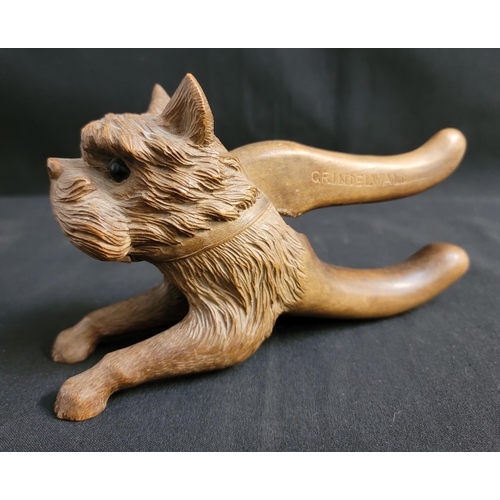 449 - VINTAGE CARVED WOODEN NUTCRACKER
in the form of a terrier dog, the top handle marked 'GRINDELWALD', ... 