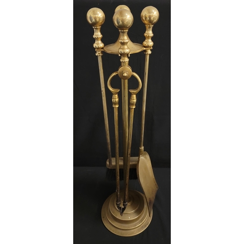 632 - BRASS FIRESIDE COMPANION SET
with brush, poker, shovel and tongs on stand, 68cm high