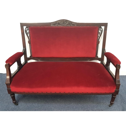 672 - EDWARDIAN MAHOGANY FRAMED RED VELVET UPHOLSTERED SOFA
the mahogany fame with carved and pierced deta... 