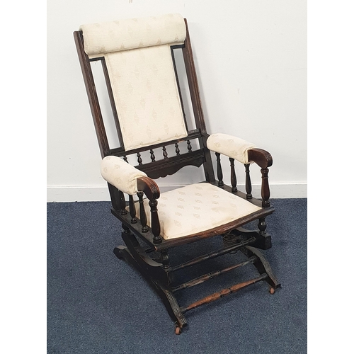 722 - AMERICAN STYLE MAHOGANY ROCKING CHAIR
with cream fabric upholstery, approximately 105cm high