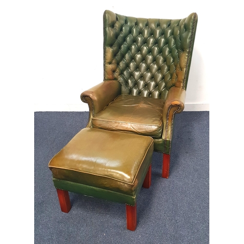 731 - GREEN LEATHER CHESTERFIELD STYLE WING BACK ARM CHAIR
the curved button back with stud edge detail, t... 