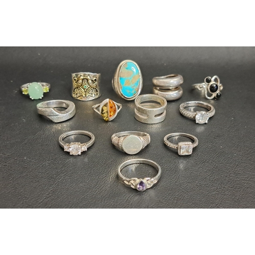 142 - GOOD SELECTION OF THIRTEEN SILVER RINGS
including a large turquoise set dress ring, a jade coloured ... 