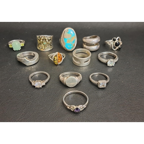 142 - GOOD SELECTION OF THIRTEEN SILVER RINGS
including a large turquoise set dress ring, a jade coloured ... 