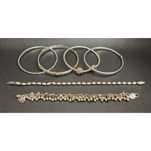 189 - THREE SILVER BANGLES AND THREE SILVER BRACELETS
including one bangle with gold plated cross detail, ... 