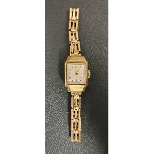 205 - LADIES NINE CARAT GOLD RECORD WRISTWATCH
the dial with alternating Arabic numerals and five minute b... 