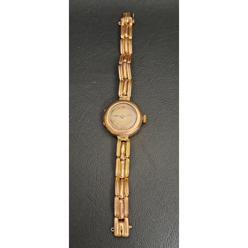 237 - LADIES NINE CARAT GOLD WRISTWATCH
circa 1920s, the dial with Roman numerals, on nine carat gold brac... 