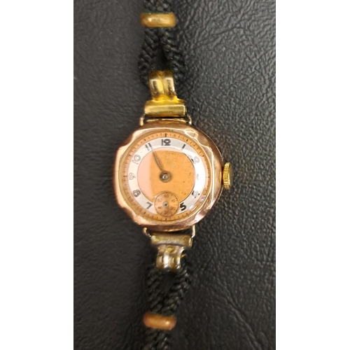 240 - LADIES NINE CARAT GOLD CASED WRISTWATCH
circa 1940s, the dial with Arabic numerals and subsidiary se... 