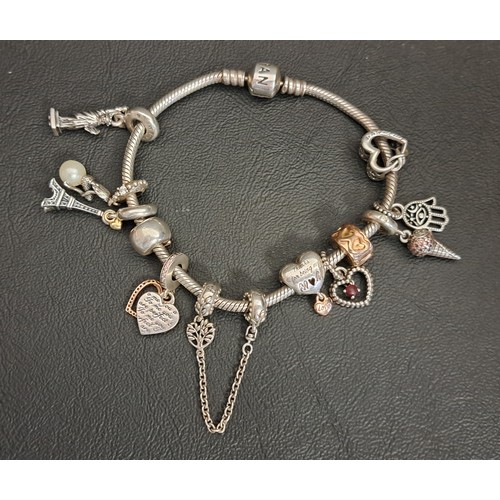 46 - PANDORA MOMENTS SILVER CHARM BRACELET
together with nine various Pandora charms (many dangle example... 