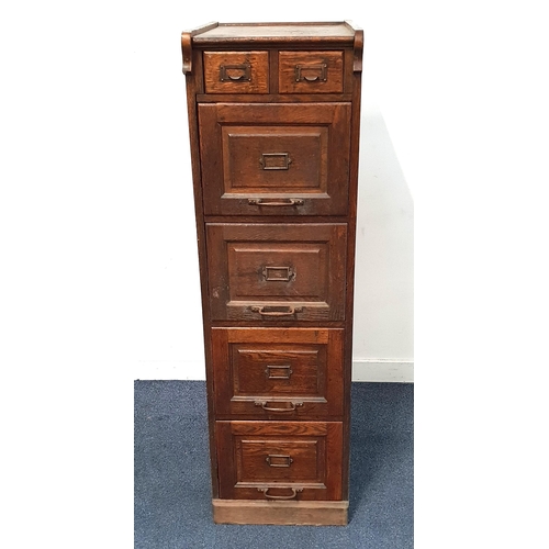 679 - ANTIQUE OAK FILING CABINET
with two index card drawers over four larger drawers, with copper name ho... 