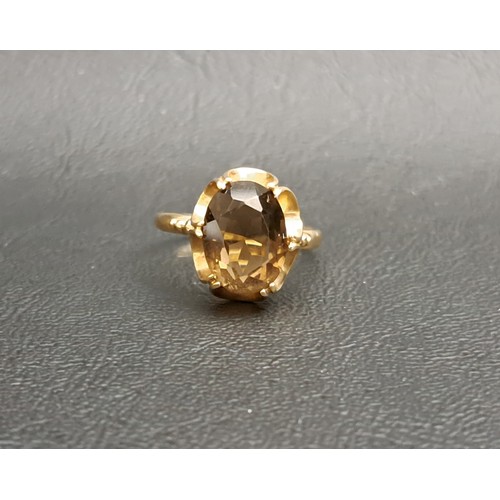 187 - SMOKY QUARTZ SINGLE STONE RING
the oval cut quartz measuring approximately 11.9mm x 8.9mm x 5.8mm, o... 