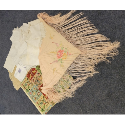 525 - ASSORTMENT OF TEXTILES
to include a silk fringed pale pink embroidered shawl, cream embroidered silk... 