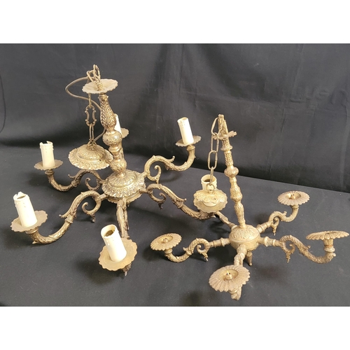 705 - TWO BRASS CEILING LIGHTS
one with six branches and candle-style light fixtures, 63cm diameter and ap... 