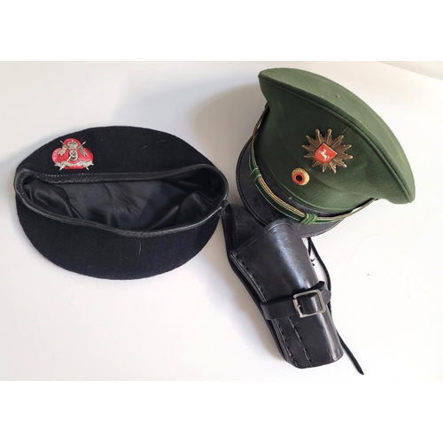 454 - WEST GERMAN NIEDERSACHSEN STATE POLICE CAP 
alongside black beret with 9th Queen's Royal Lancers cap... 