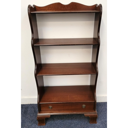 660 - MAHOGANY WATERFALL BOOKCASE
with four tiers above a single bottom drawer, 56 x 112 x 30cm